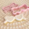 A product display image of our cookie debosser and cutter in the taylor swift inspired sunglasses, theme.